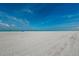 Expansive white sand beach with crystal-clear water, ideal for sunbathing and swimming at 238 Sun Ketch Ct # 95, Treasure Island, FL 33706