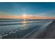 Beautiful beach view with sunrise and calm waves lapping on the shore at 238 Sun Ketch Ct # 95, Treasure Island, FL 33706