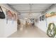 Spacious garage with ample storage, pegboard, and bright lighting at 238 Sun Ketch Ct # 95, Treasure Island, FL 33706