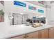 Bright kitchen features quartz countertops, stainless sink, and white appliances for a clean and modern look at 238 Sun Ketch Ct # 95, Treasure Island, FL 33706