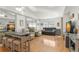 Open-concept living room boasts hardwood floors, modern furniture, and tasteful décor for a relaxing atmosphere at 238 Sun Ketch Ct # 95, Treasure Island, FL 33706
