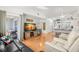 Bright living room featuring hardwood floors, comfortable seating, and a sliding glass door to the outdoors at 238 Sun Ketch Ct # 95, Treasure Island, FL 33706