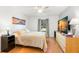 Comfortable main bedroom features sunny windows, and an attractive wall art, creating a serene and inviting atmosphere at 238 Sun Ketch Ct # 95, Treasure Island, FL 33706