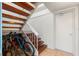 Wooden staircase with white railing provides access to an upper level, and has space for bike storage at 238 Sun Ketch Ct # 95, Treasure Island, FL 33706