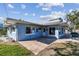 Backyard with a paved patio area and a view of the swimming pool at 2451 Baywood W Dr, Dunedin, FL 34698