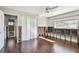 Bedroom featuring wood-look floors, a window, and closet with sliding doors at 2451 Baywood W Dr, Dunedin, FL 34698