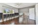 Bedroom featuring wood-look floors and a window with exterior views at 2451 Baywood W Dr, Dunedin, FL 34698