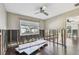 Bedroom with hardwood floors, window and supplies undergoing repairs at 2451 Baywood W Dr, Dunedin, FL 34698
