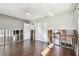 Bedroom with wood-look floors, a window, and closet with sliding doors at 2451 Baywood W Dr, Dunedin, FL 34698