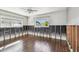 Bedroom with wood-look floors and two windows providing natural light and exterior views at 2451 Baywood W Dr, Dunedin, FL 34698