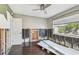 Bedroom with hardwood floors and window undergoing repairs at 2451 Baywood W Dr, Dunedin, FL 34698