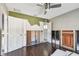 Bedroom with hardwood floors and doors undergoing repairs at 2451 Baywood W Dr, Dunedin, FL 34698