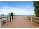 Wooden dock extending out into the water, offering picturesque views of the bay and boat slips at 2451 Baywood W Dr, Dunedin, FL 34698