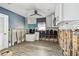 Kitchen featuring cabinetry, a window and new flooring at 2451 Baywood W Dr, Dunedin, FL 34698