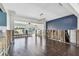 Spacious open-concept living area featuring updated wood floors and natural light at 2451 Baywood W Dr, Dunedin, FL 34698