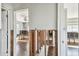 Bright living room space featuring wood-look floors and an open doorway at 2451 Baywood W Dr, Dunedin, FL 34698