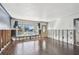 Bright living room with hardwood floors, a large window, and freshly painted walls at 2451 Baywood W Dr, Dunedin, FL 34698