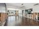 Expansive open-concept living space with dark wood floors and abundant natural light at 2451 Baywood W Dr, Dunedin, FL 34698