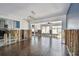 Inviting living area showcasing an open layout, wood floors, and a modern light fixture at 2451 Baywood W Dr, Dunedin, FL 34698