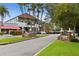 Scenic view of Main Street in Dunedin, showcasing well-maintained sidewalks, trees, and charming architecture at 2451 Baywood W Dr, Dunedin, FL 34698