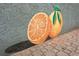 Vibrant mural of oranges on textured wall in a Dunedin community, adding a touch of local flavor at 2451 Baywood W Dr, Dunedin, FL 34698