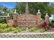 Entrance sign for Edgewater Park and Municipal Marina, surrounded by lush landscaping and well-maintained brickwork at 2451 Baywood W Dr, Dunedin, FL 34698