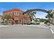 The Greater Dunedin Chamber of Commerce building in a vibrant downtown street view at 2451 Baywood W Dr, Dunedin, FL 34698