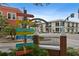 Charming intersection featuring vibrant directional signs pointing to local attractions and businesses at 2451 Baywood W Dr, Dunedin, FL 34698