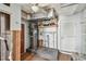 Basement utility room with shelving, plumbing, ceiling fan, water heater and wood flooring at 2451 Baywood W Dr, Dunedin, FL 34698