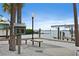 Scenic waterfront area with seating, a little library, and access to boat slips and open water at 2451 Baywood W Dr, Dunedin, FL 34698