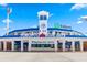 Front view of TD Ballpark, home of the Toronto Blue Jays, with clear blue skies above the stadium entrance at 277 Ashley Ct, Dunedin, FL 34698