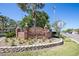 Brick Edgewater Park sign at Municipal Marina creates a warm welcome with landscaping at 277 Ashley Ct, Dunedin, FL 34698