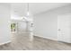 Open-concept living area featuring modern flooring and natural light from sliding glass doors at 277 Ashley Ct, Dunedin, FL 34698