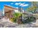 Charming outdoor cafe featuring shaded seating, lush landscaping, and vibrant atmosphere at 277 Ashley Ct, Dunedin, FL 34698