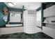 Bathroom featuring a standalone tub with brass fixtures and a glass block shower at 2906 Pemberton Creek Dr, Seffner, FL 33584