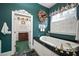 Bathroom featuring a standalone tub and a door leading to a closet area at 2906 Pemberton Creek Dr, Seffner, FL 33584