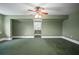 Well-lit bedroom featuring large windows, neutral tones, and a ceiling fan with lights at 2906 Pemberton Creek Dr, Seffner, FL 33584