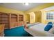 Bedroom is complete with built-in bookshelves, desk, and window at 2906 Pemberton Creek Dr, Seffner, FL 33584
