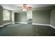 Spacious bedroom with windows offering natural light and featuring a ceiling fan at 2906 Pemberton Creek Dr, Seffner, FL 33584