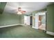 Large bedroom with an open doorway and connecting rooms and hallway at 2906 Pemberton Creek Dr, Seffner, FL 33584