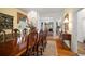Elegant dining room boasting a chandelier, fireplace, and hardwood floors at 2906 Pemberton Creek Dr, Seffner, FL 33584