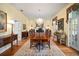 Formal dining room with fireplace, chandelier, and a large wood dining table at 2906 Pemberton Creek Dr, Seffner, FL 33584