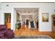 Grand foyer with wood floors, staircase, and decorative art creating a welcoming ambiance at 2906 Pemberton Creek Dr, Seffner, FL 33584