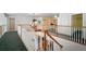 Upstairs hallway offering a view of the first floor and natural light at 2906 Pemberton Creek Dr, Seffner, FL 33584