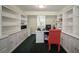 Home office is complete with built-in bookshelves and cabinets at 2906 Pemberton Creek Dr, Seffner, FL 33584