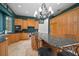 Kitchen with custom cabinetry, granite countertops, stainless appliances, and large island with bar seating at 2906 Pemberton Creek Dr, Seffner, FL 33584