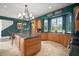Gourmet kitchen with custom cabinets, granite counters, and stainless steel appliances at 2906 Pemberton Creek Dr, Seffner, FL 33584