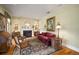 Inviting living room featuring a fireplace, traditional decor, and a comfortable seating area, perfect for relaxation at 2906 Pemberton Creek Dr, Seffner, FL 33584