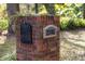 Close up of a charming brick mailbox adorned with climbing vines and the house number displayed at 2906 Pemberton Creek Dr, Seffner, FL 33584