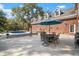 Outdoor patio with dining and seating areas, alongside a refreshing swimming pool at 2906 Pemberton Creek Dr, Seffner, FL 33584